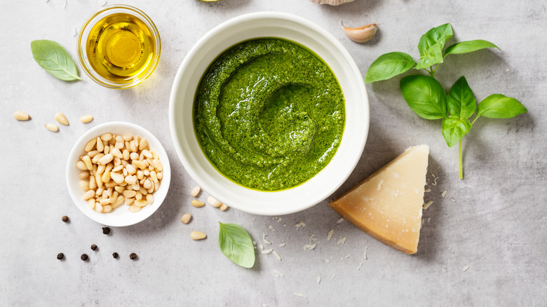 Pesto in white bowl with basil