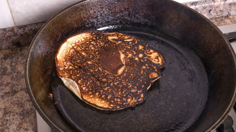 Burnt pancake in pan