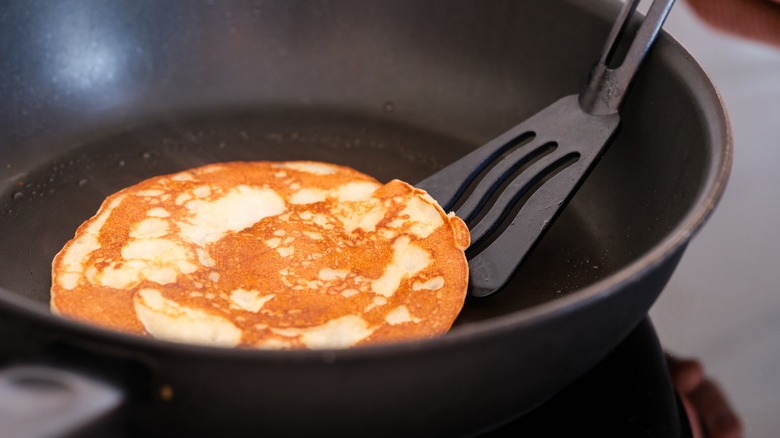 Flipping pancake with spatula