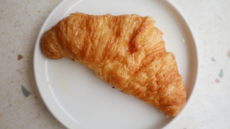 Croissant on white plate