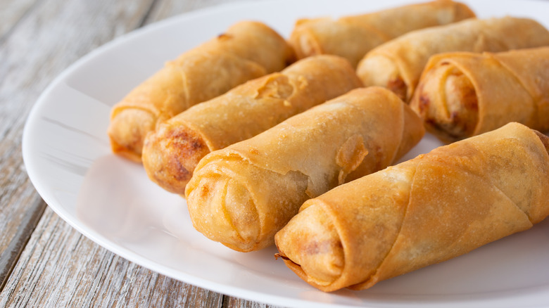 Egg rolls on white plate