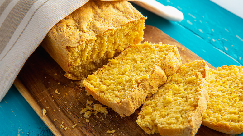 Sliced cornbread on cutting board