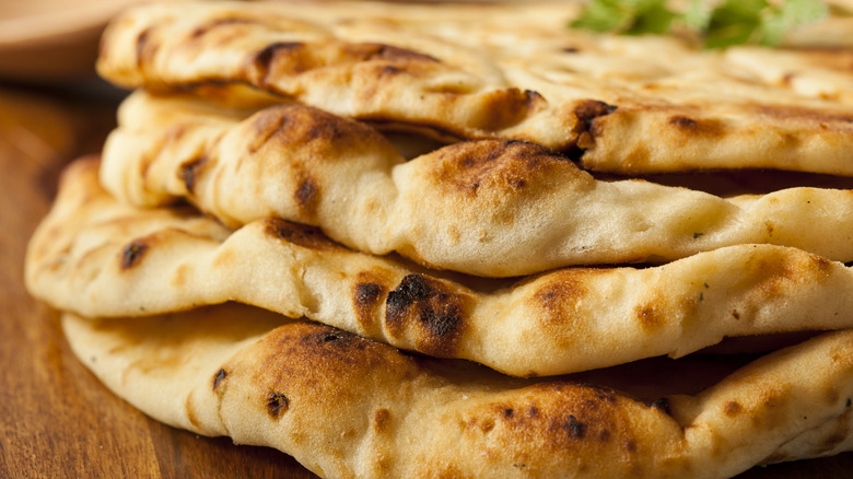 Stack of naan on plate