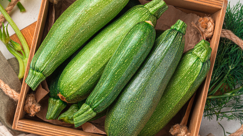 Zucchinis inside wooden box