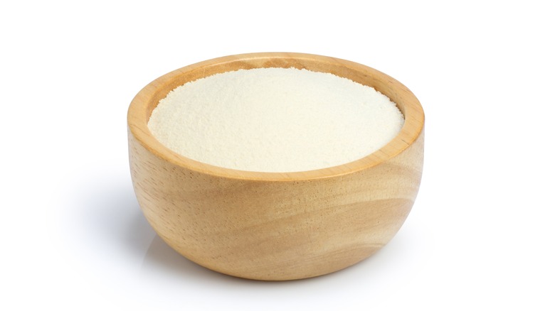 Wooden bowl with milk powder