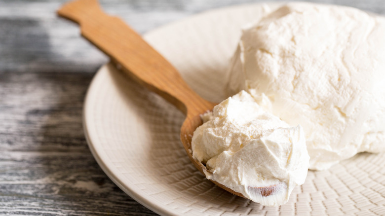 Wooden spoon with mascarpone