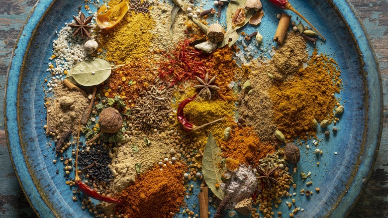 Indian spices on blue plate