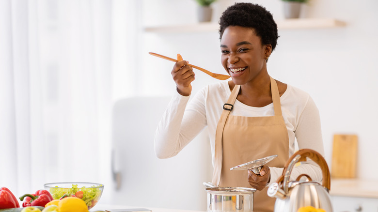 Woman tasting food