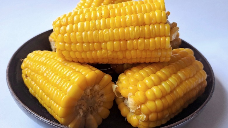 Three pieces of cooked corn