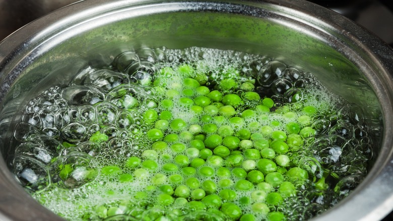 Boiling peas in pot