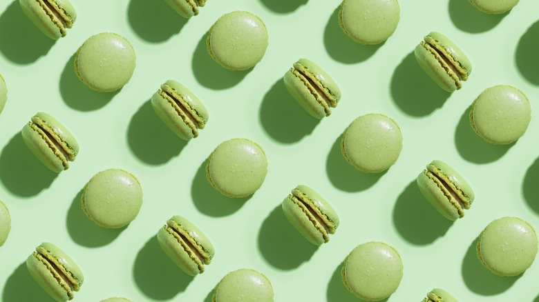 Green pistachio macarons in rows