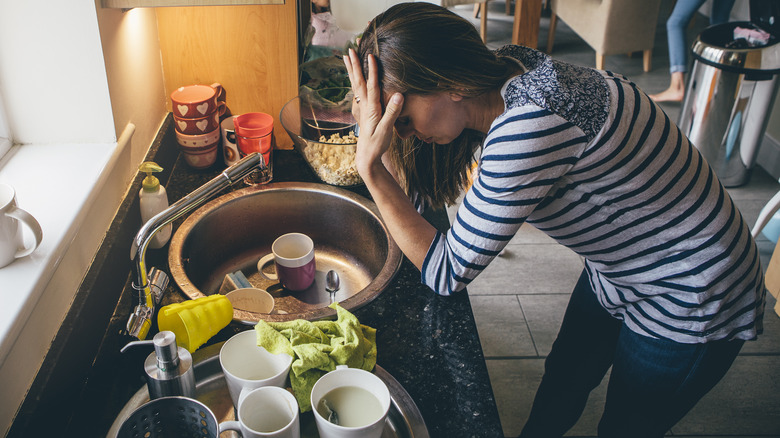 stressed woman inside kitchen