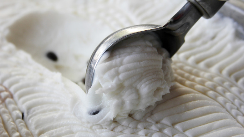 Scooping ice cream with spoon