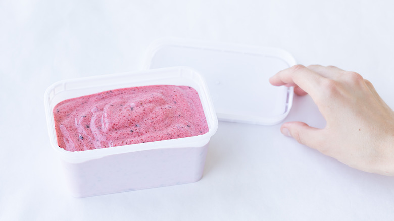 Strawberry ice cream in container