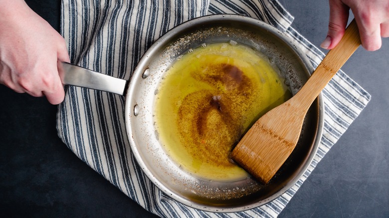 swirling brown butter in pan