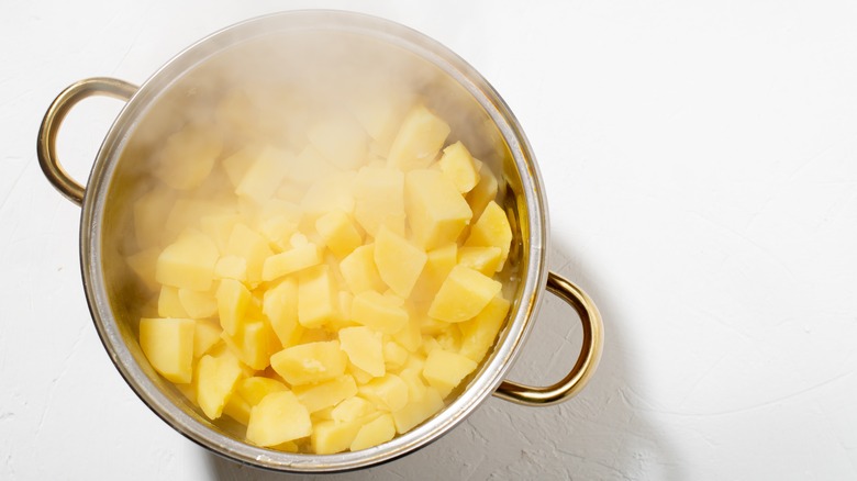 pot of cooked steaming potatoes