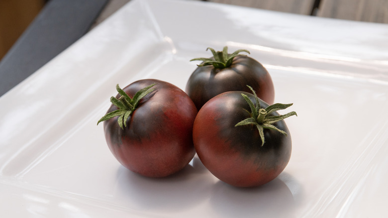 cherokee purple tomatoes on plate