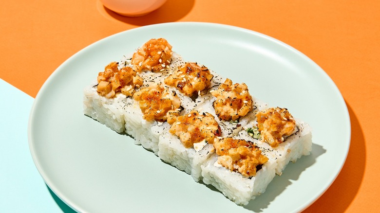 Ssushi with rice on plate