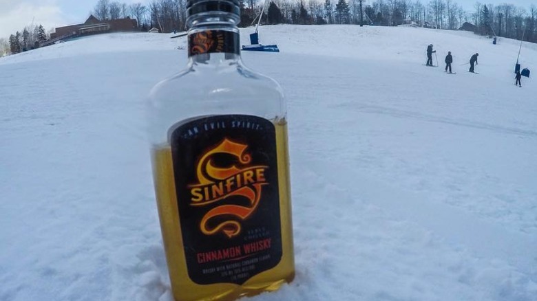 Sinfire Cinnamon Whisky on snow