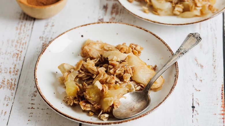 Apple crisp in rustic white bowl