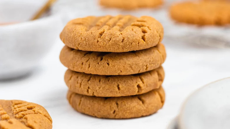 Four stacked peanut butter cookies