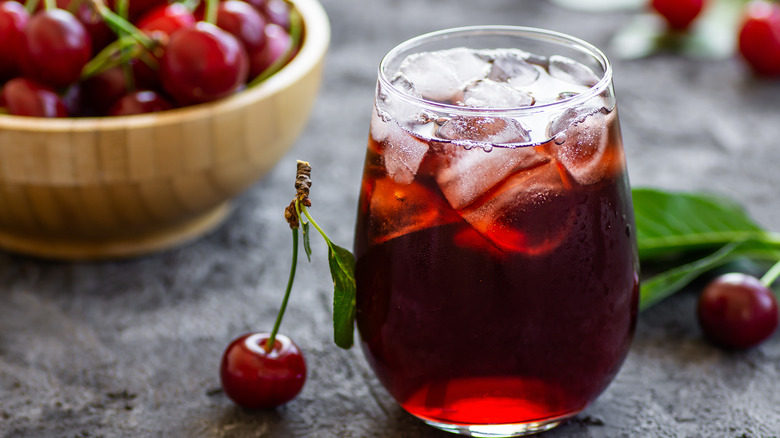 Cherry juice on ice in glass