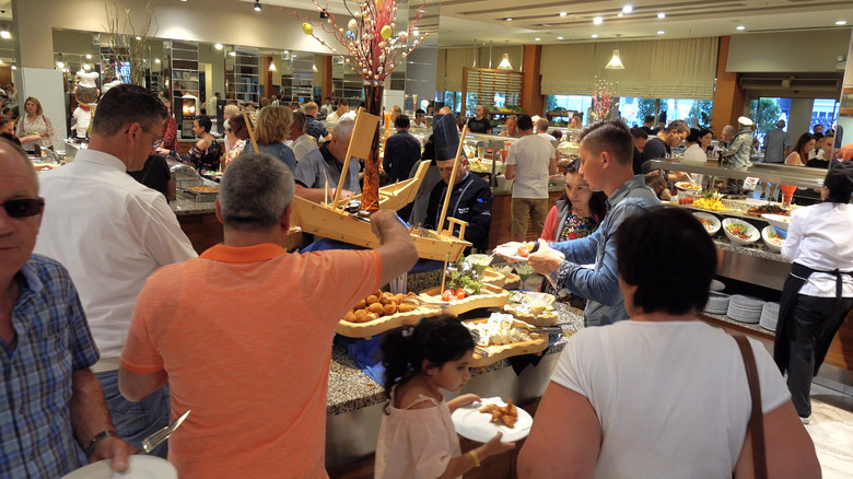 Guests queueing at crowded buffet