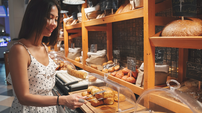 Woman browsing pastry selection