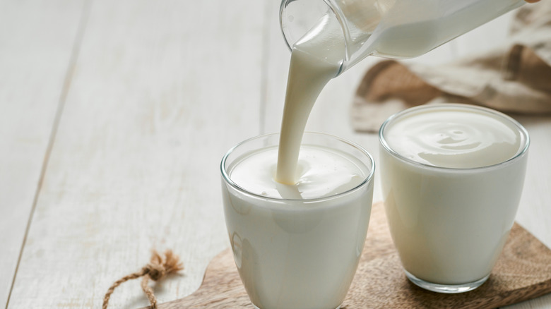 Pouring buttermilk into a glass