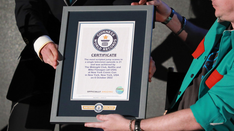 men holding Guinness World Records frame