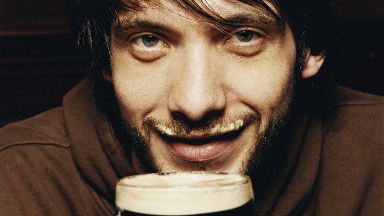 man with beer foam mustache