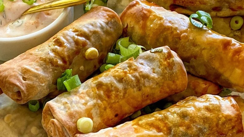 Egg rolls with scallion garnish