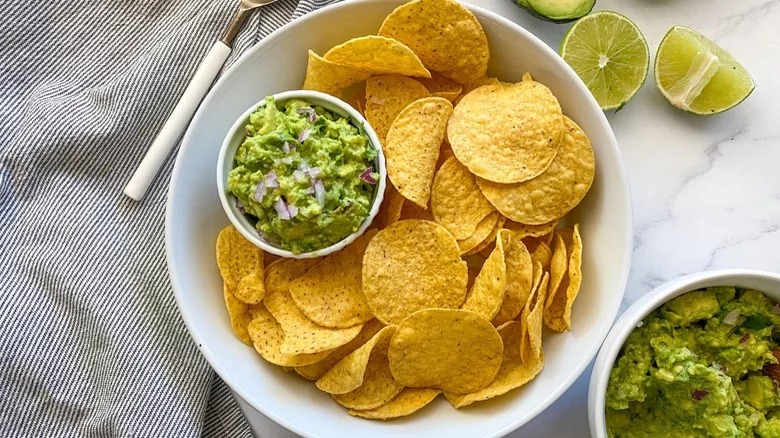 Homemade guacamole plated with tortilla chips