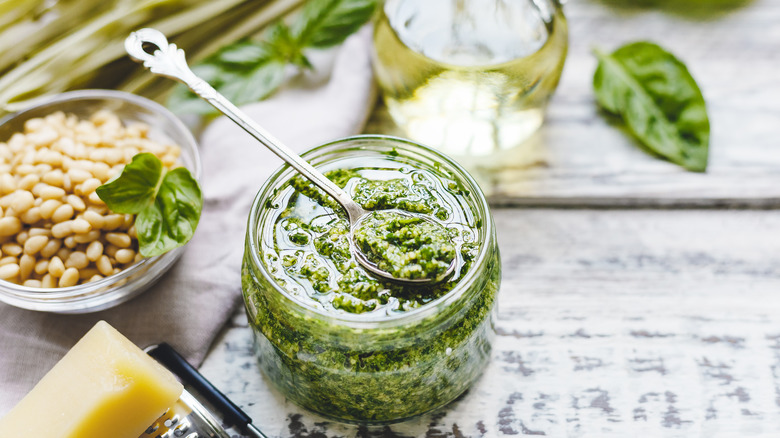 Jar of pesto with spoon