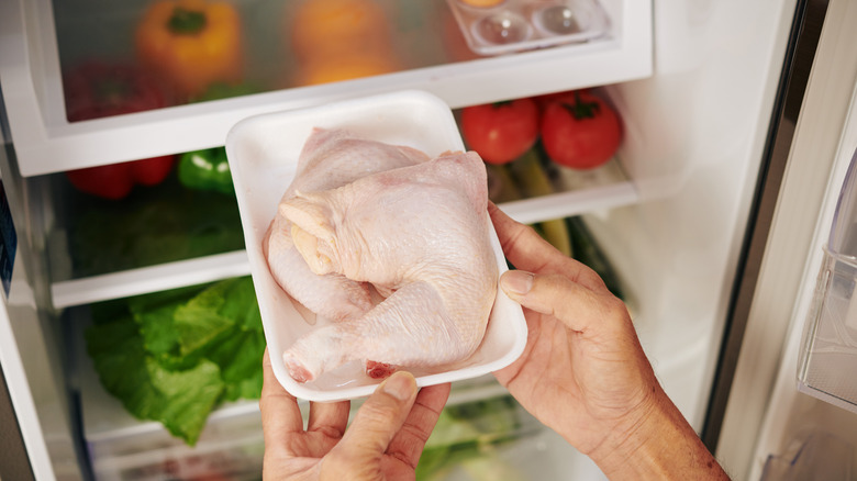 putting raw chicken in fridge