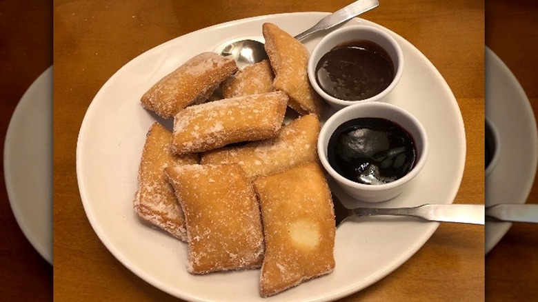 zeppole with raspberry and chocolate sauces