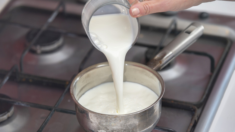 Pouring buttermilk in saucepan