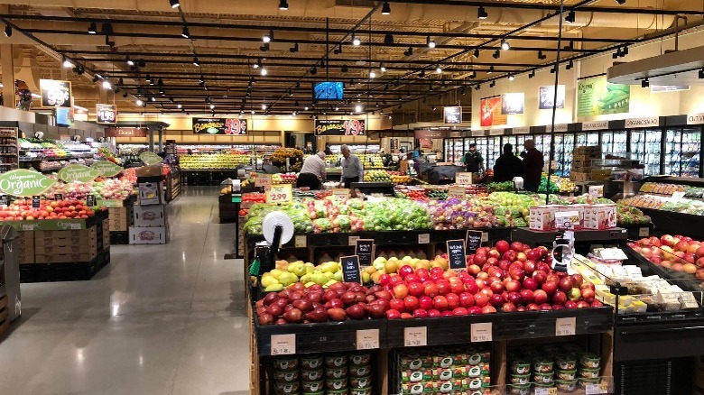 Wegmans produce department and customers