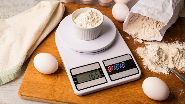 weighing flour on kitchen scale