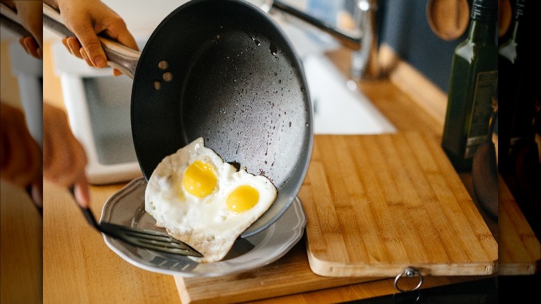 pouring eggs out of nonstick pan