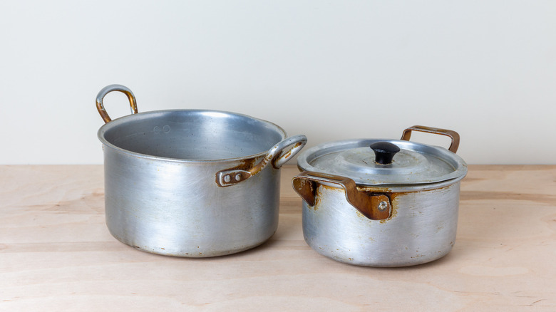 rusted silver cookware on counter