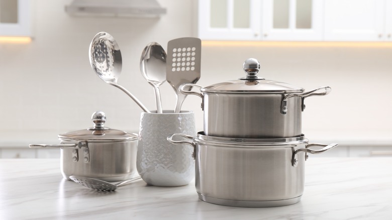 stainless cookware with metal utensils