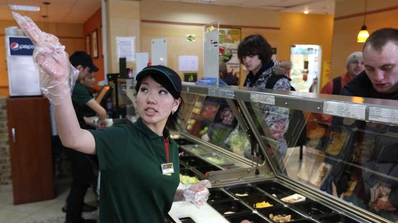 Employee at Subway counter