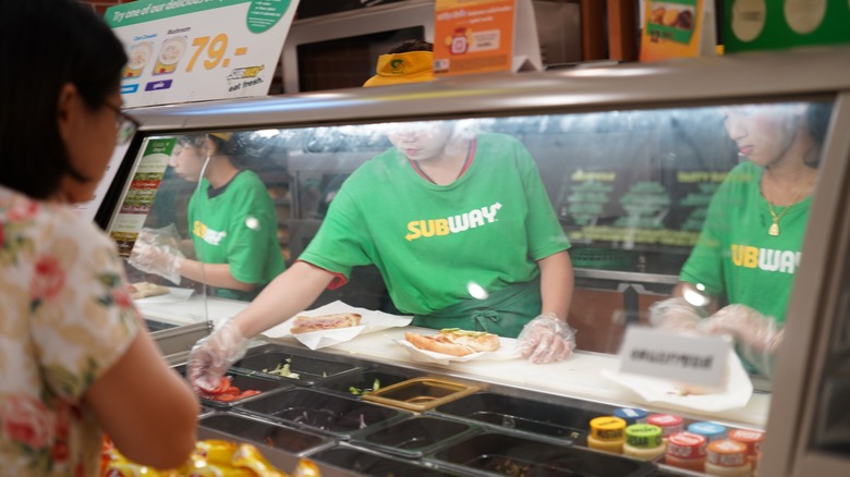 employees behind subway counter