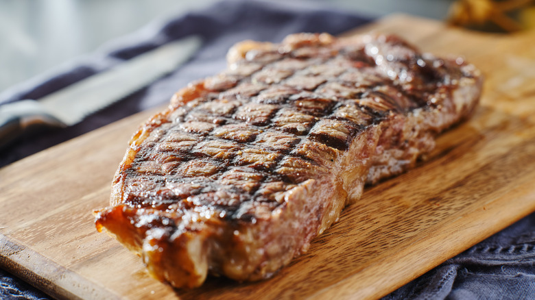 Steak resting on cutting board