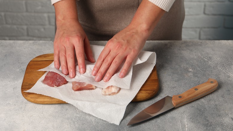 Drying meat with towel