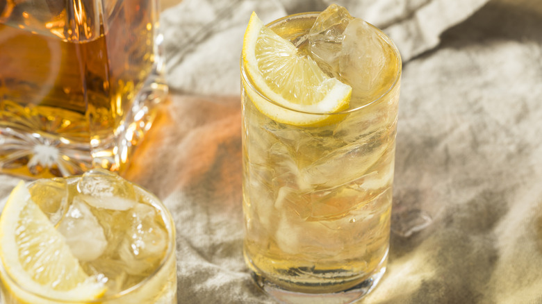 two cocktail glasses with lemon