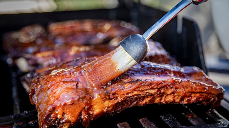 basting ribs with barbecue sauce