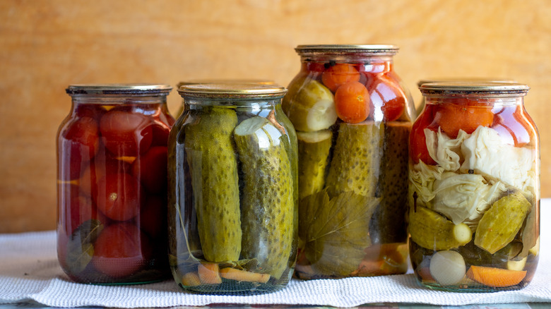 two shelves of pickled vegetables