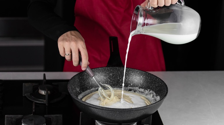 making cheese sauce in pan